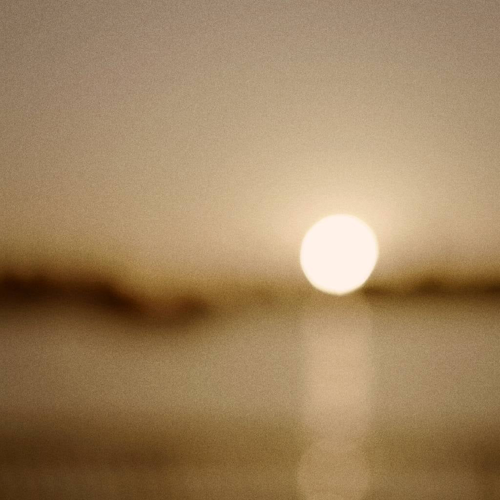 Sunset casting a warm, soft glow over the water, reflecting Enso Design Lab’s commitment to harmony and natural beauty in every design.