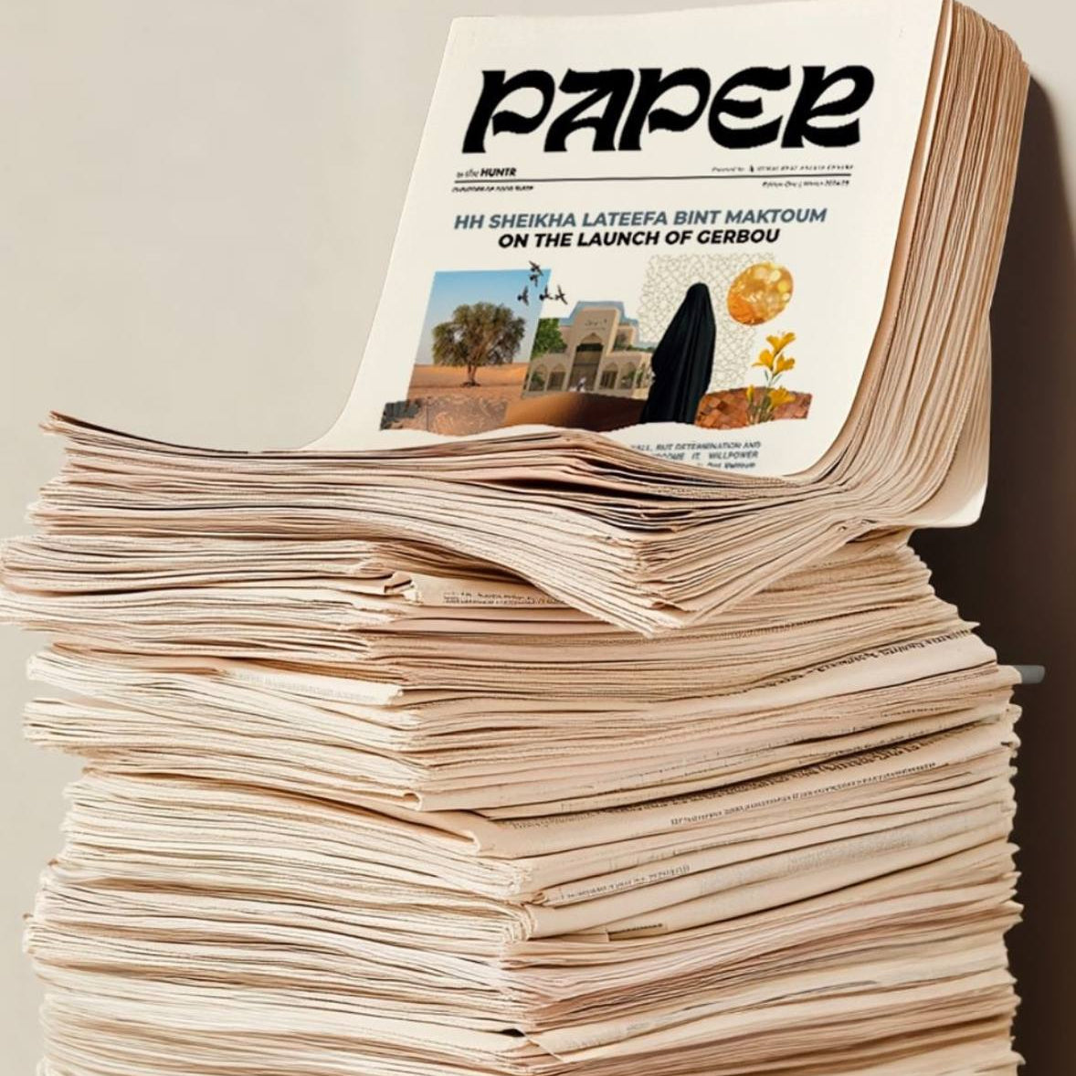 A stack of PAPER by The HUNTR newspapers featuring Enso Design Lab™ in the ‘Meet the Makers’ section.