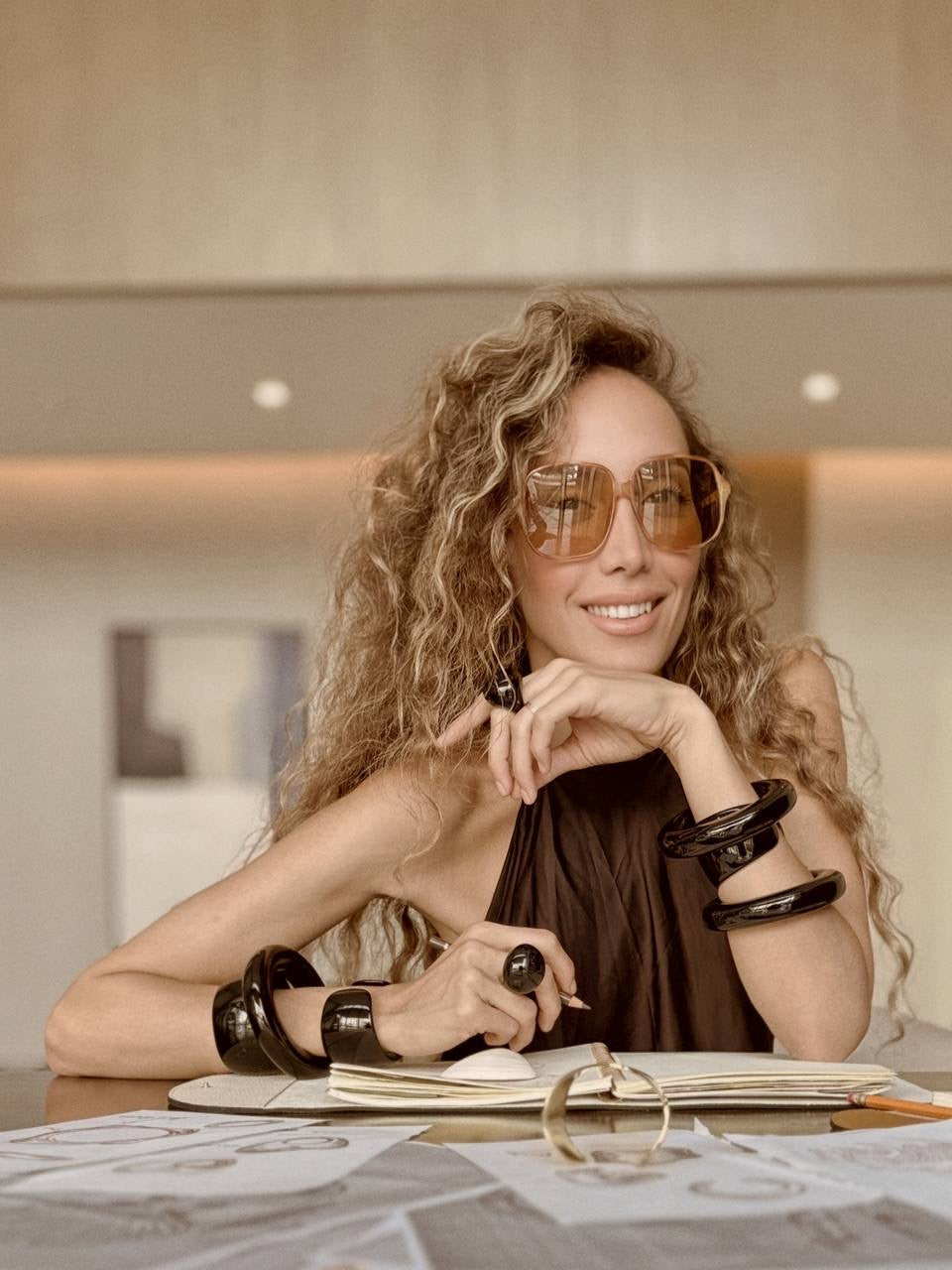 Ani Han, Creative Director of Enso Design Lab, working with design materials and sketches