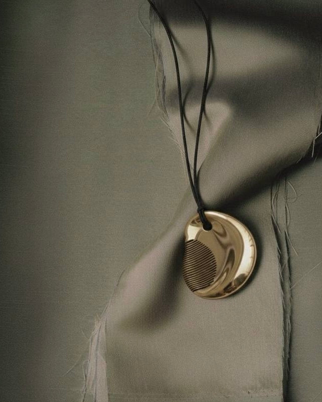 Comb Necklace by Ani Han — sculptural pendant in anodized aluminum with fine linear texture, handcrafted minimalist jewelry