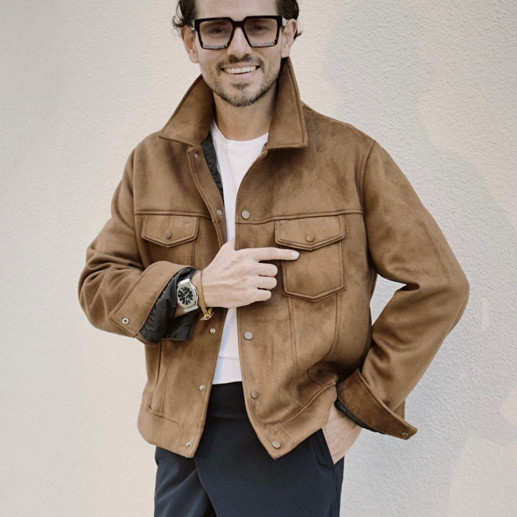 Bulat Han, CEO of Enso, wearing a stylish brown jacket, embodies elegant minimalism. Recognized as one of the “10 Prominent Male CEOs in 2024” by EliteX Magazine, his leadership redefines luxury.