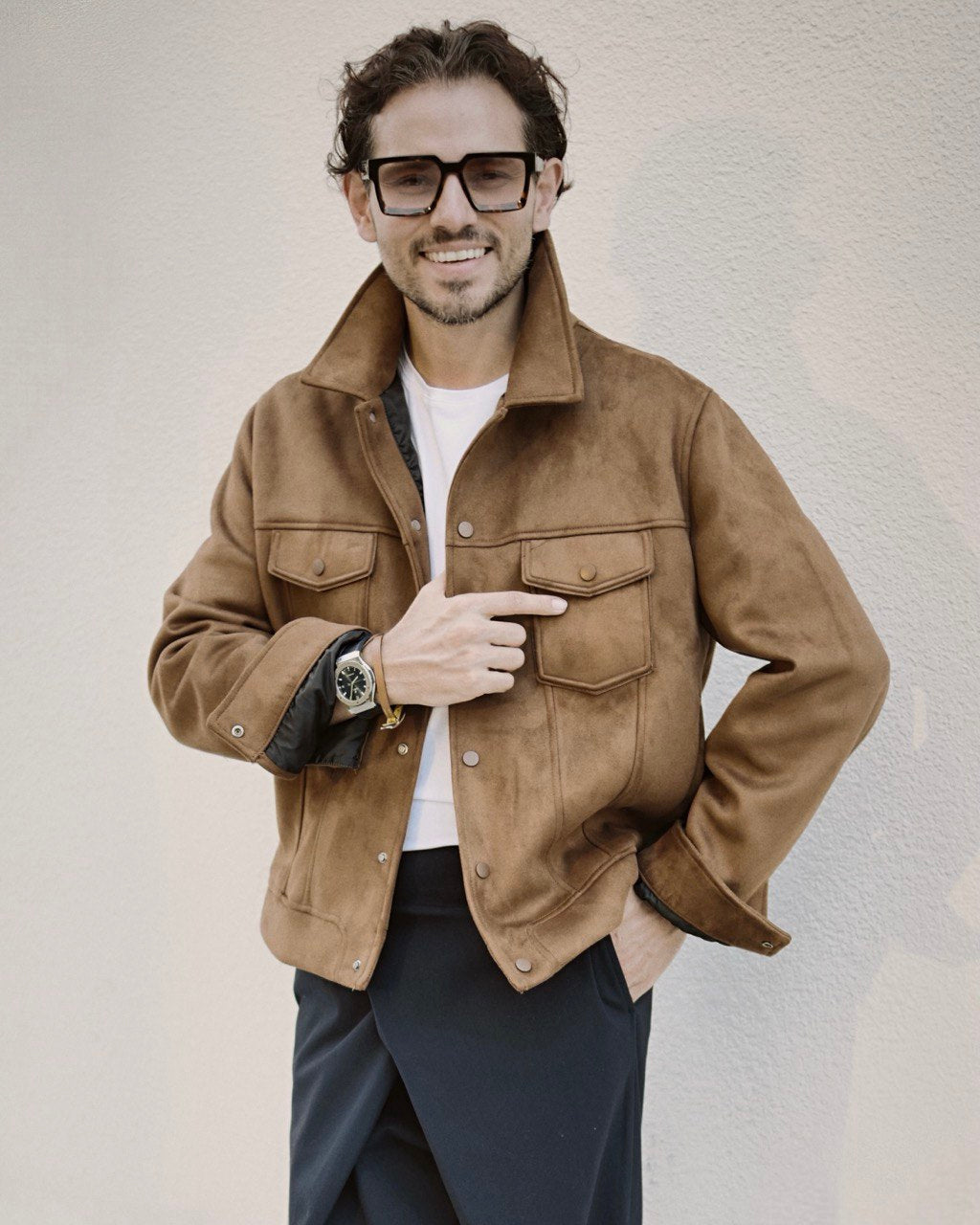 Bulat Han, CEO of Enso, wearing a stylish brown jacket, embodies elegant minimalism. Recognized as one of the “10 Prominent Male CEOs in 2024” by EliteX Magazine, his leadership redefines luxury.