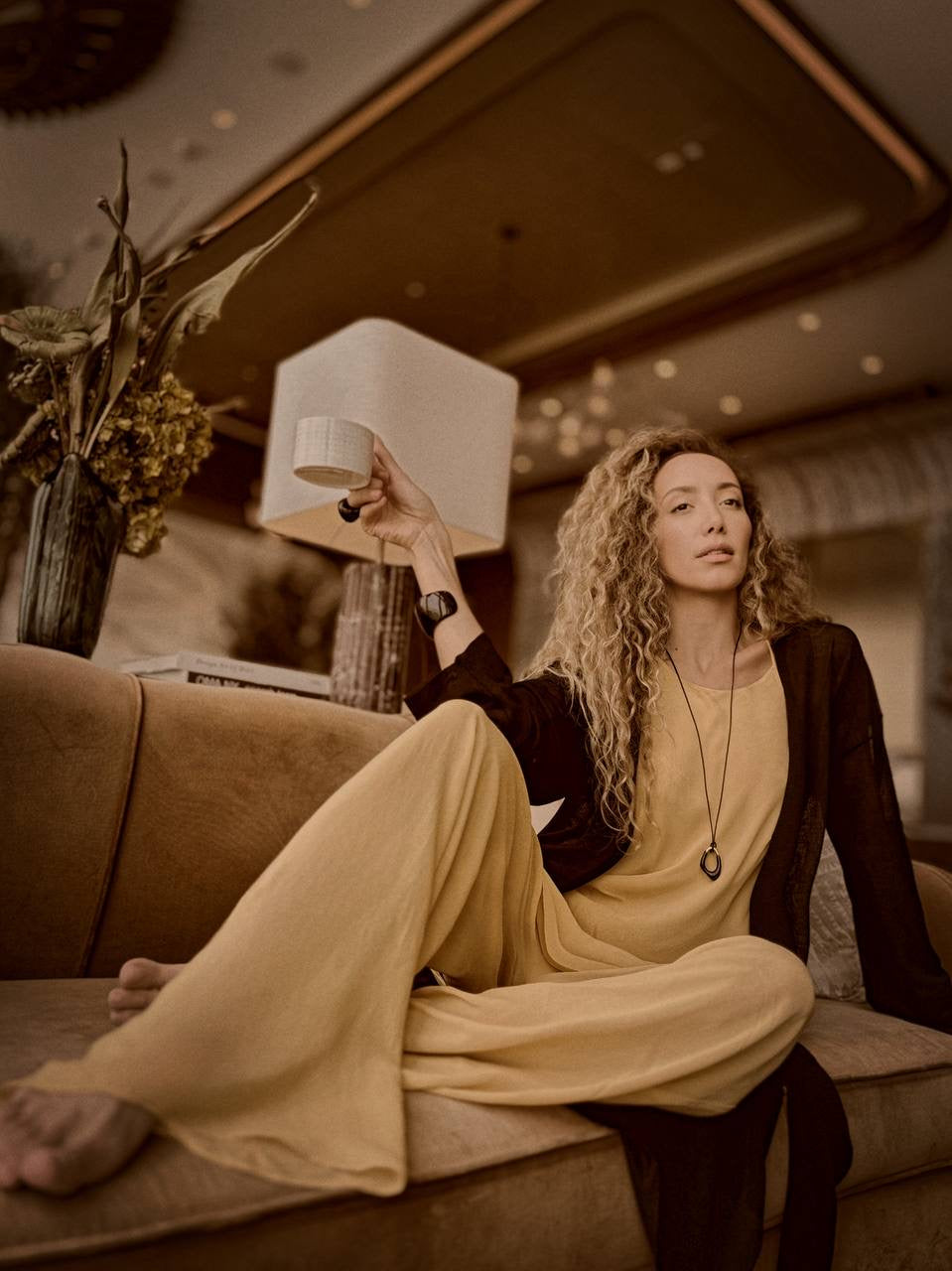 Ani Han, Creative Director of Enso, stands elegantly beside a marble table, embodying the refined minimalism and quiet luxury that define her design philosophy.