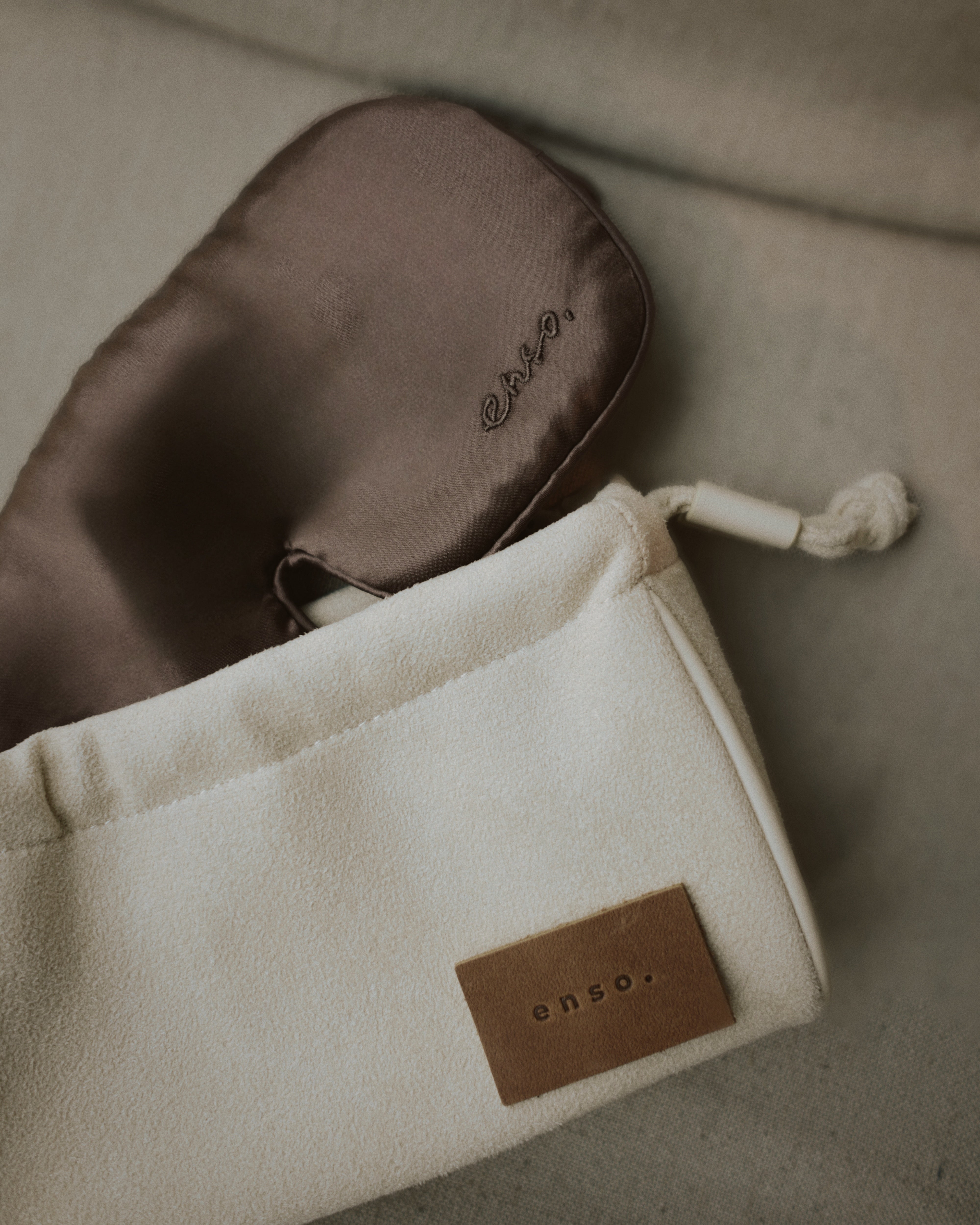 Handcrafted silk Zen Meditation Mask by Enso Design Lab and Ani Han, shown with a soft fabric pouch