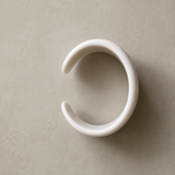 Object 03
Wide cuff bangle in polished white finish