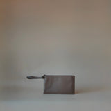 Front view of the Wristlet Leather Pouch in Grey Pebbled Leather by Enso Design Lab™, designed by Ani Han.