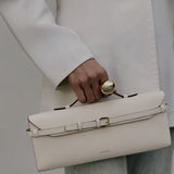 Tori Bag by Enso Design Lab™ in ivory Epsom leather, minimalist design guided by Ani Han, echoing the understated refinement seen in Hermès or The Row.