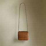 Ava Bag by Enso Design Lab™ in golden brown premium grain leather, quietly echoing Hermès-like refinement under Ani Han’s direction.