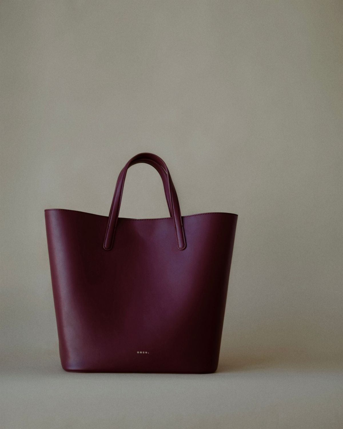 Element Tote Bag by Enso Design Lab™ in burgundy cowhide leather, minimal design guided by Ani Han, quietly echoing Hermès-like refinement.