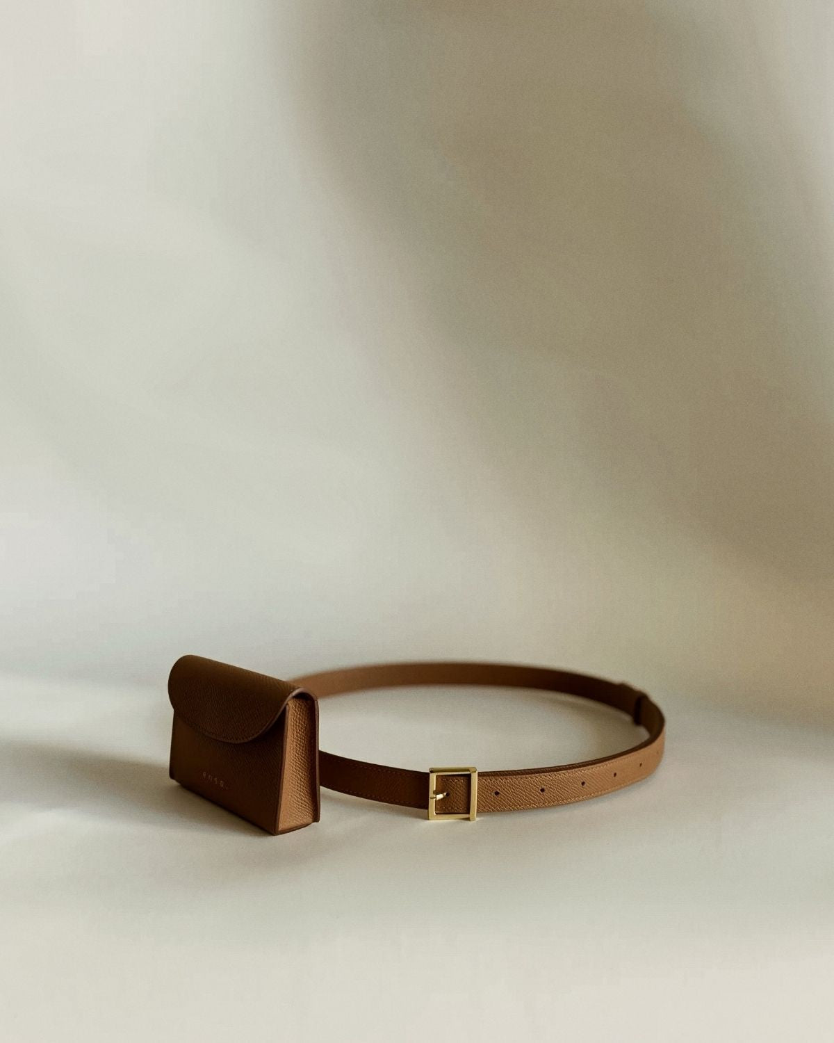 Ava Belt’s sleek profile, merging functionality and elegance reminiscent of top-tier luxury silhouettes.