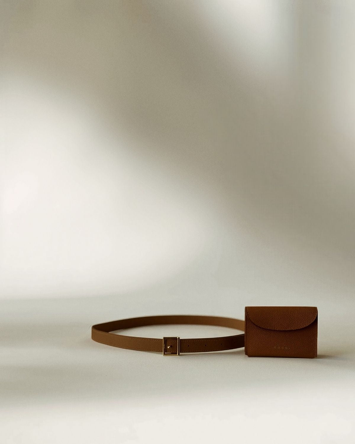 Ava Belt’s sleek profile, merging functionality and elegance reminiscent of top-tier luxury silhouettes.