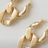 Evolution Earrings by Enso Design Lab™ with 18k gold plating, 27 mm x 17 mm, elegant and lightweight.