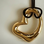 Flow - Heart Necklace by Enso Design Lab™ with 18k gold plating, pendant size 4 cm x 3 cm, sculptural and elegant heart design.