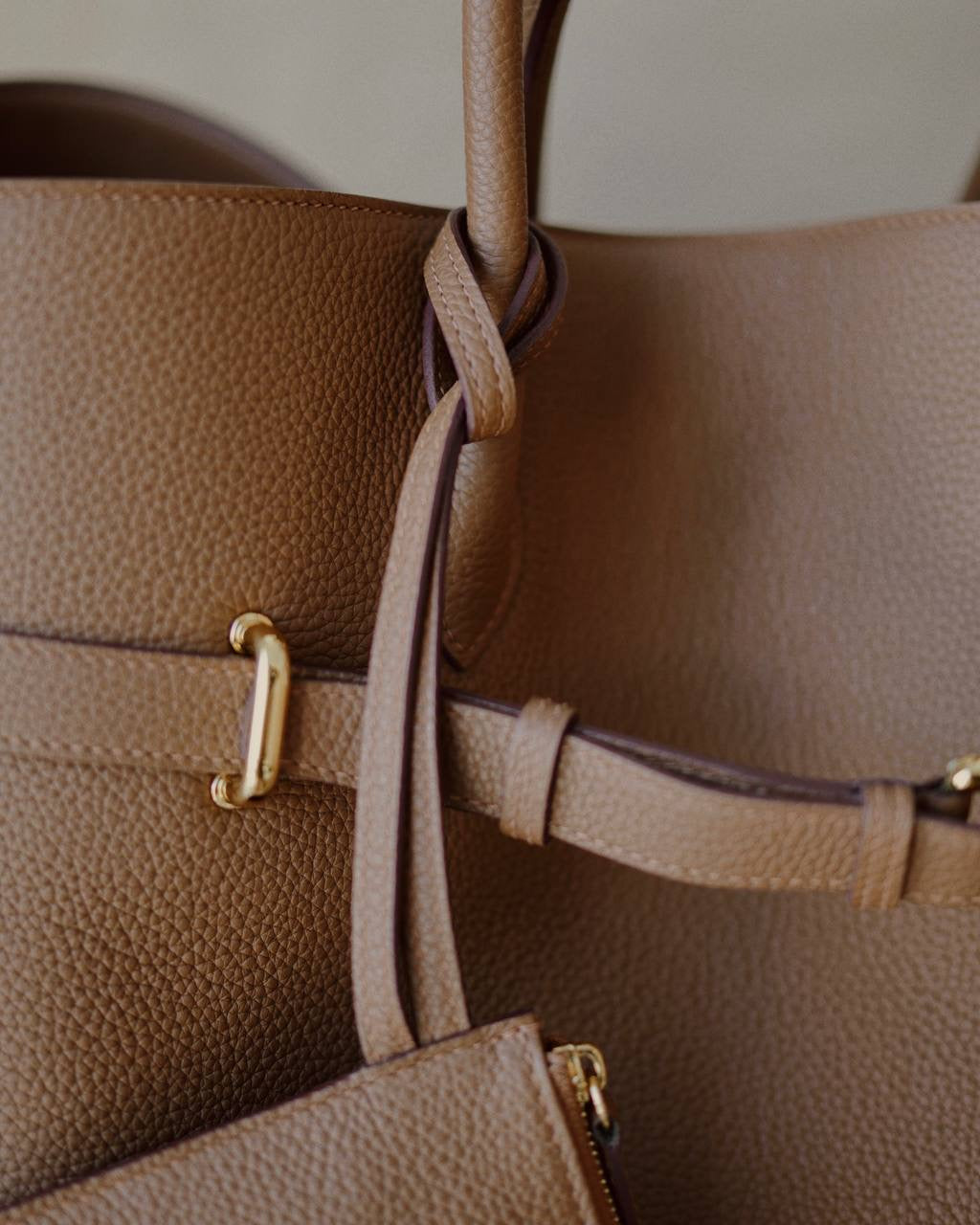 Close-up of the Noa Bag’s gold-tone base hardware by Enso Design Lab™, showcasing premium craftsmanship and attention to detail.