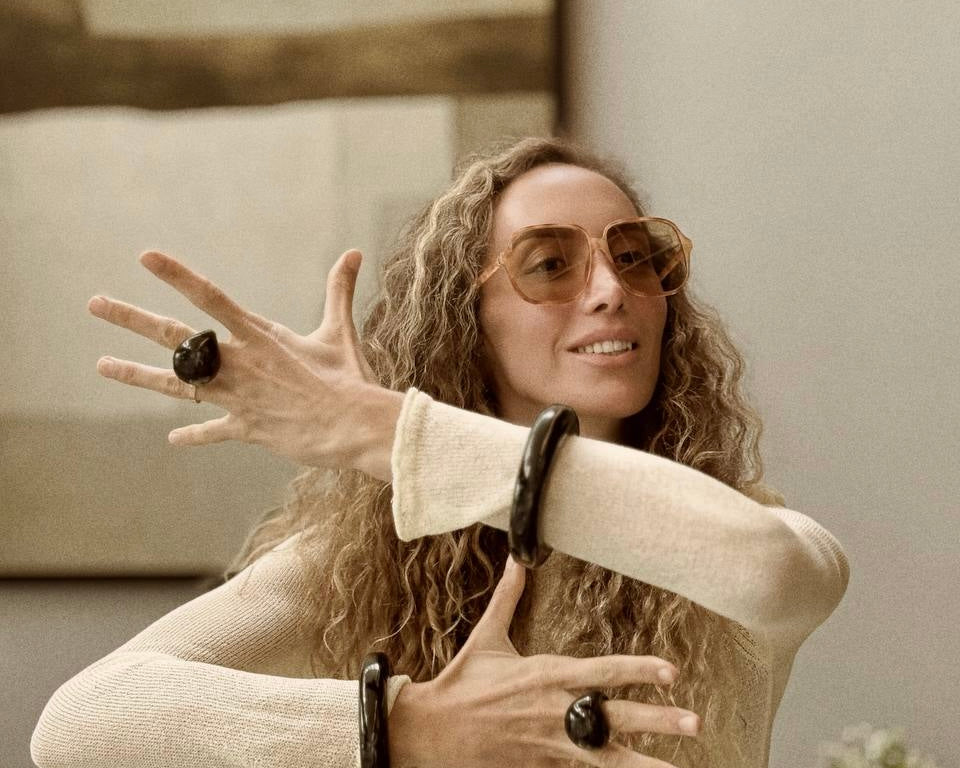 Ani Han with sunglasses and jewelry in a casual setting