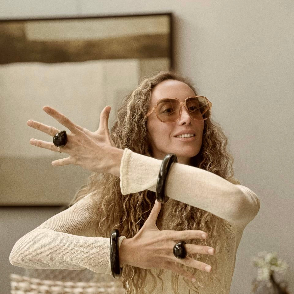 Ani Han with sunglasses and jewelry in a casual setting