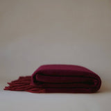 Luxurious cashmere scarf by Enso Design Lab™, crafted under the vision of Creative Director Ani Han, in a deep burgundy shade with soft fringes.