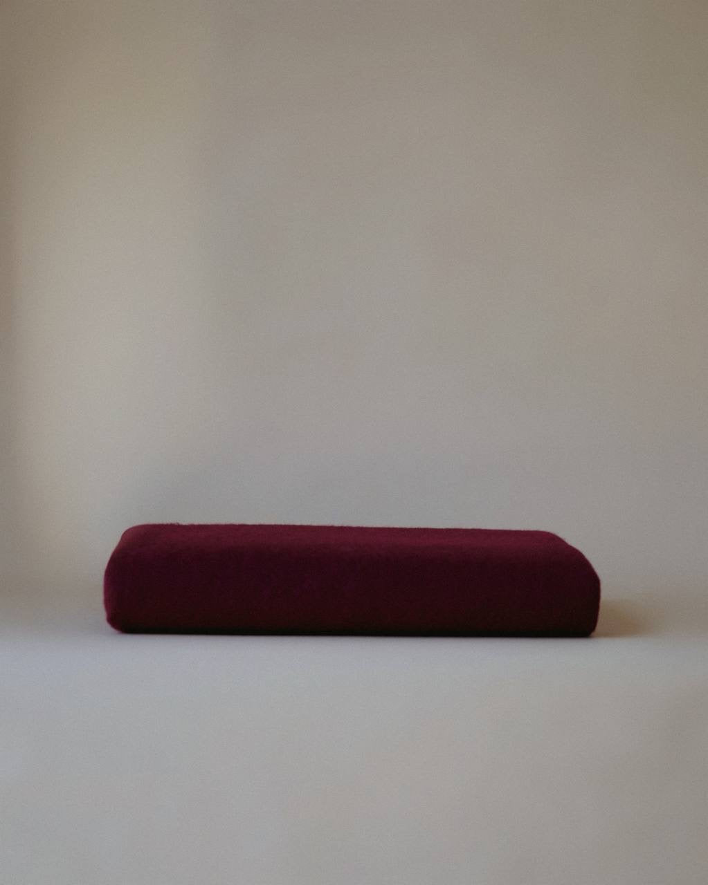 Luxurious cashmere scarf by Enso Design Lab™, crafted under the vision of Creative Director Ani Han, in a deep burgundy shade with soft fringes.