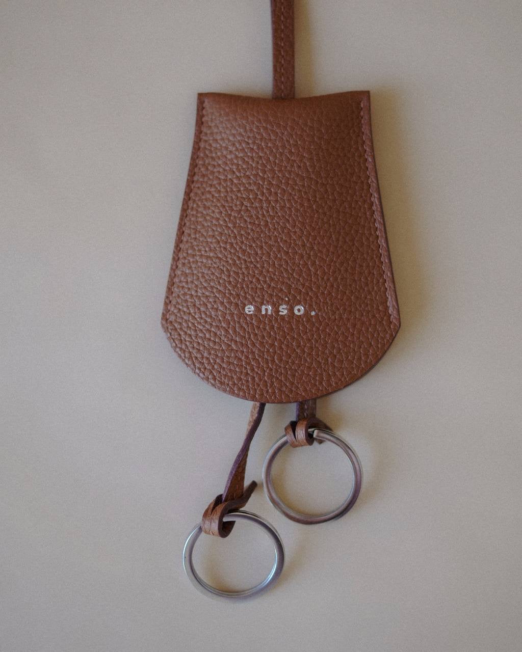 Front view of the Leather Key Holder Necklace in Golden Brown Pebbled Leather by Enso Design Lab™, designed by Ani Han.