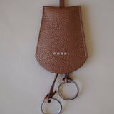 Front view of the Leather Key Holder Necklace in Golden Brown Pebbled Leather by Enso Design Lab™, designed by Ani Han.