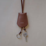 Golden Brown Key Holder Necklace by Enso Design Lab™, combining functionality and minimalist elegance.