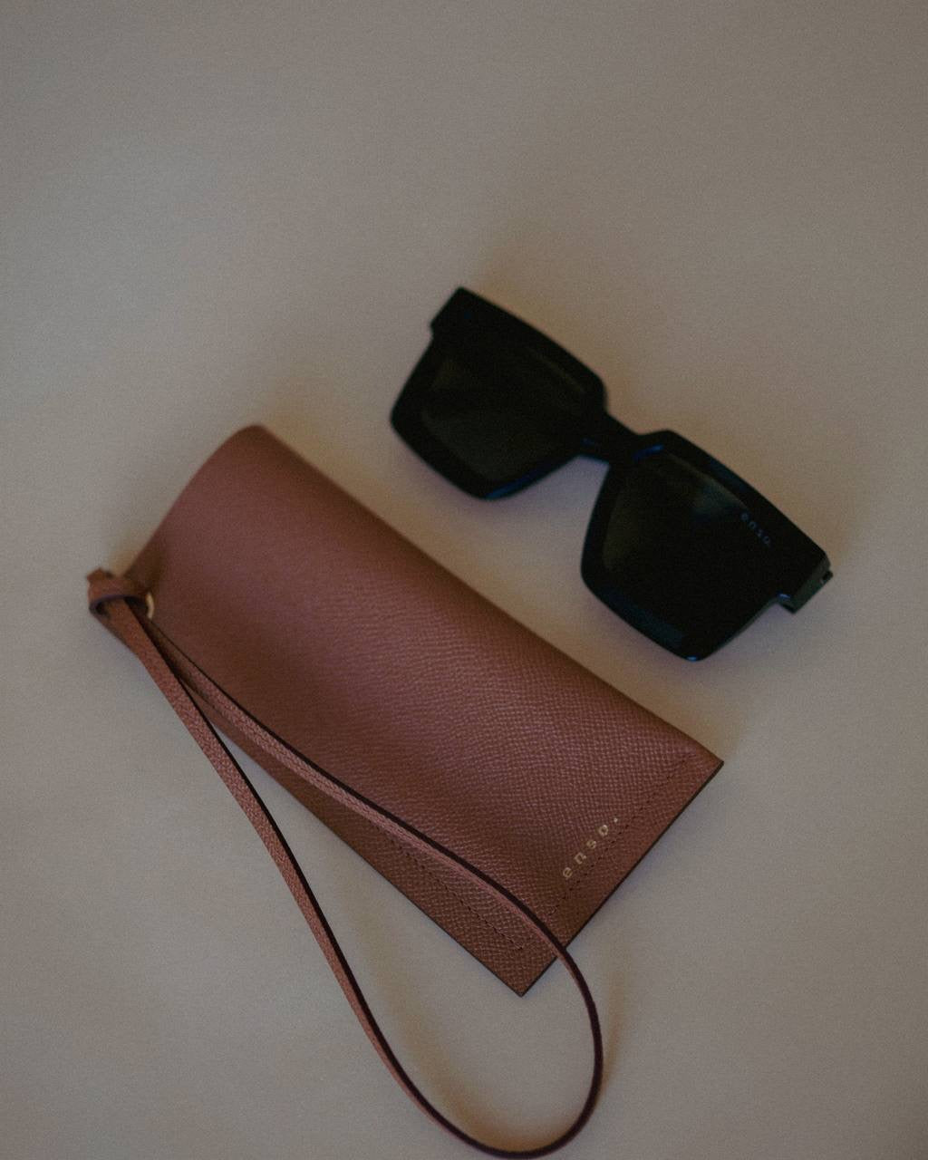 Elegant Leather Sunglasses Holder with Strap, designed for everyday use with a touch of sophistication by Ani Han.