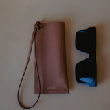 Elegant Leather Sunglasses Holder with Strap, designed for everyday use with a touch of sophistication by Ani Han.