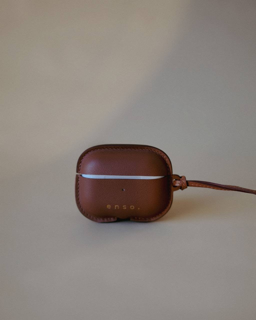 Back view of the Leather AirPods Case Necklace in Golden Brown Swift Leather, showcasing seamless design and refined details by Ani Han.