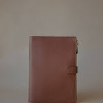 Side view of the Organizer Case, showcasing its textured Golden Brown leather and minimalist design.