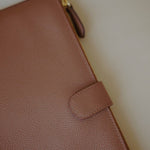 Close-up of the Leather Organizer Case, highlighting the pebbled leather texture and durable zip closure.