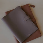 Close-up of the Leather Organizer Case, highlighting the pebbled leather texture and durable zip closure.