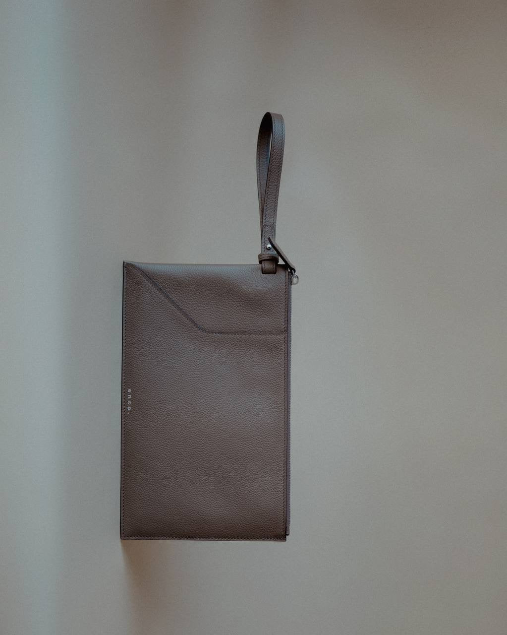 Elegant Wristlet Pouch in Grey Pebbled Leather by Enso Design Lab™, perfect for versatile use.