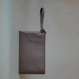 Elegant Wristlet Pouch in Grey Pebbled Leather by Enso Design Lab™, perfect for versatile use.