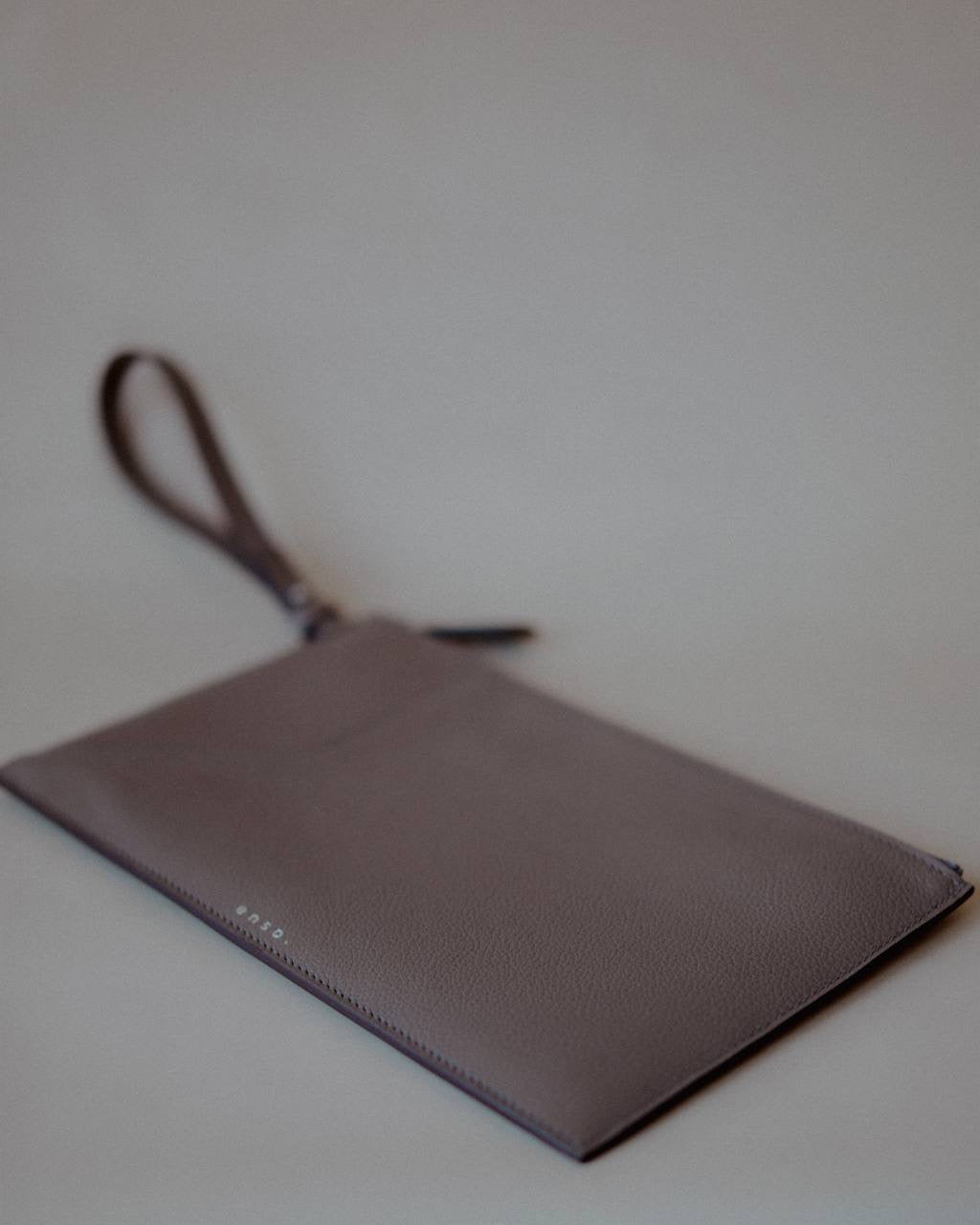 Top view of the Wristlet Leather Pouch, emphasizing its sleek design and luxurious craftsmanship.