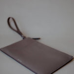 Top view of the Wristlet Leather Pouch, emphasizing its sleek design and luxurious craftsmanship.