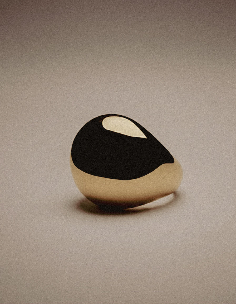 Flow Ring - handcrafted sculptural brass ring with mirror-polished finish and hand-engraved inner surface by Enso Design Lab