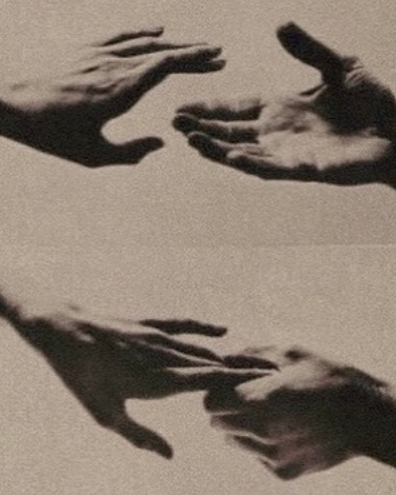 Hands shaping sculptural form in black and white, illustrating essentialism in design
