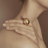 Flow Ring in gold finish — sculptural brass ring by Enso Design Lab
