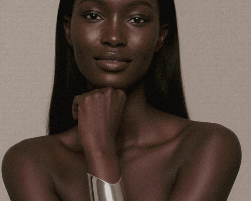 Model with long, straight hair wearing a silver Shell Cuff on a beige background.