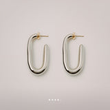 Embrace Earrings by Enso Design Lab™ with rhodium plating and 18k gold tips, 41.6 mm long, stylish and lightweight.