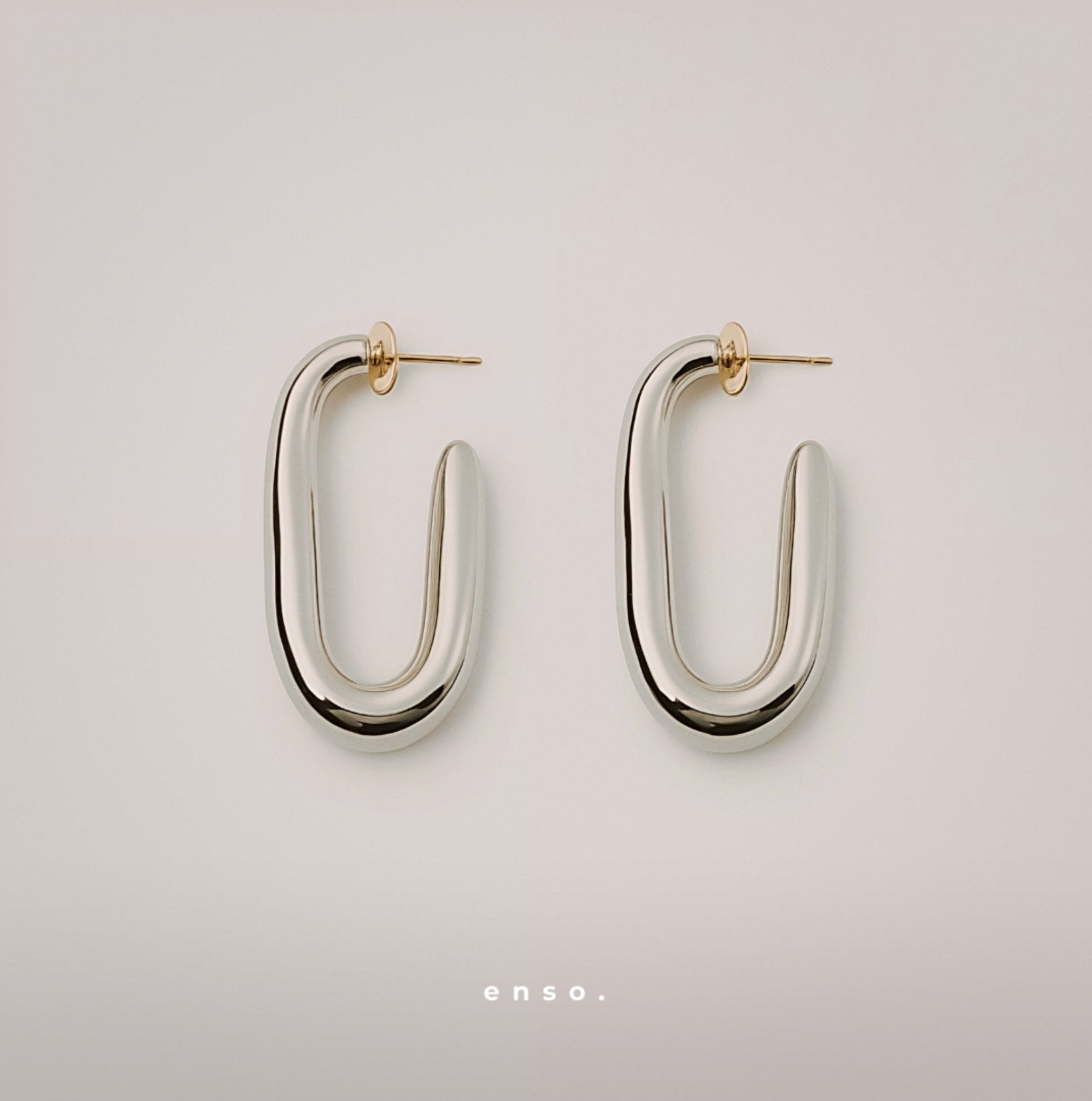 Embrace Earrings by Enso Design Lab™ with rhodium plating and 18k gold tips, 41.6 mm long, stylish and lightweight.