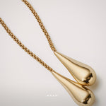 Drops of Light Necklace by Enso Design Lab™ in 18k gold plating, fluid lines, and seamless 180 cm design.