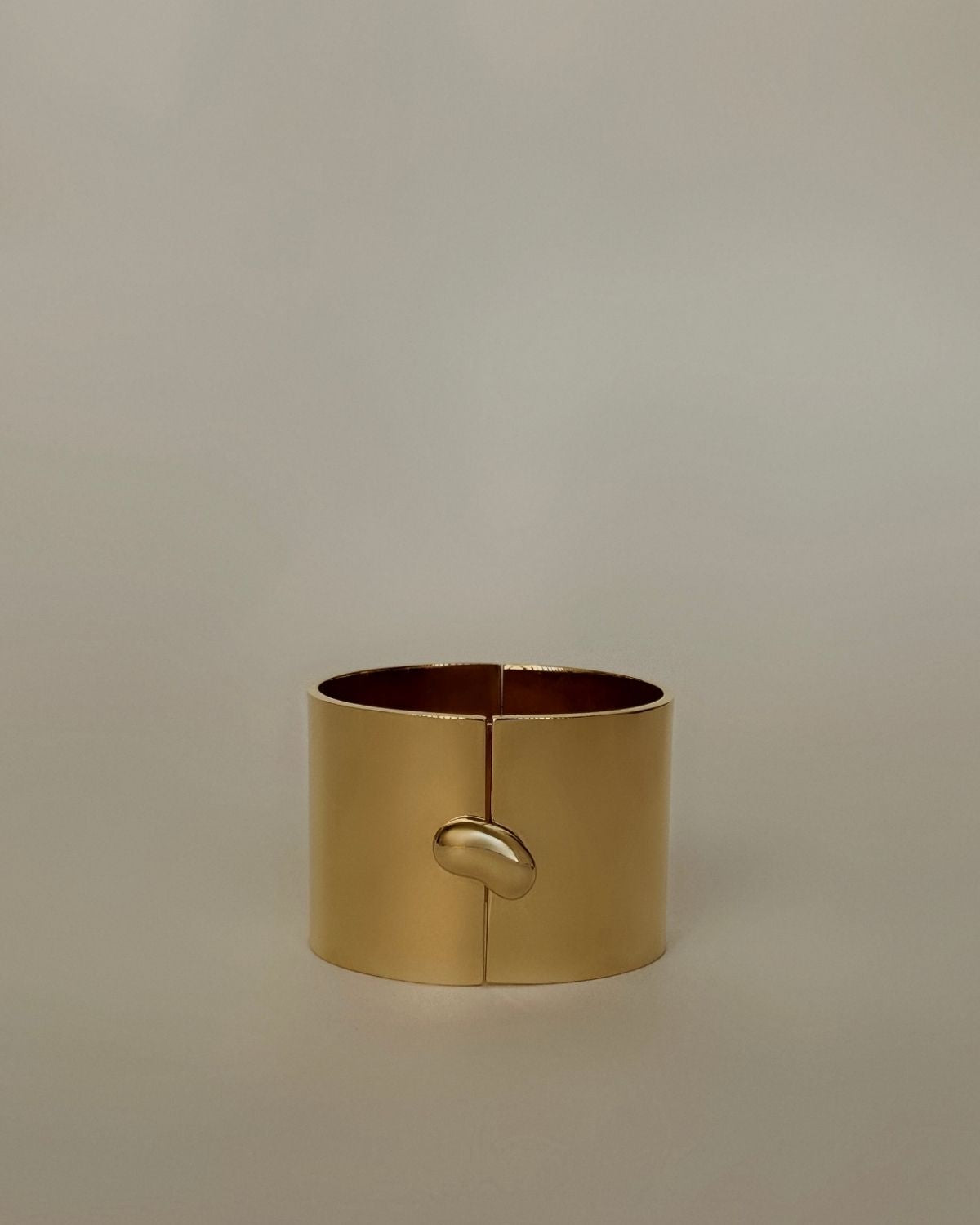 Drop Cuff Gold by Enso Design Lab™, designed by Ani Han – a minimalist 18K gold-plated bracelet with a sleek, organic design.